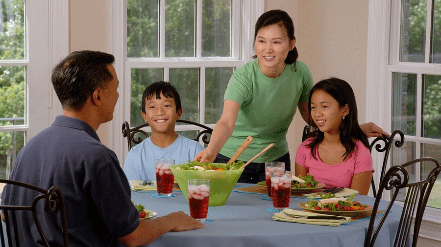 mother serving family dinner