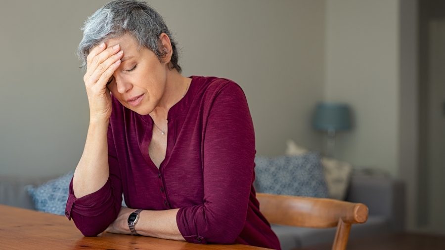 Older woman holding face in pain