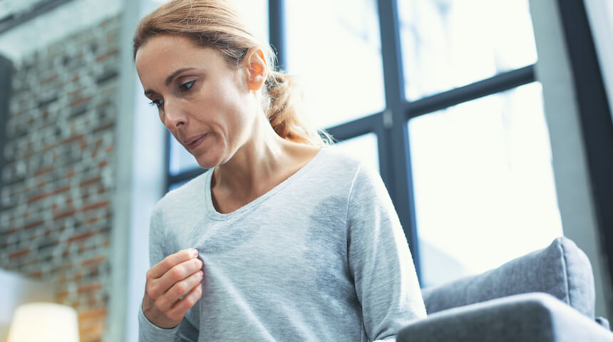 Woman sweating having a hot flash