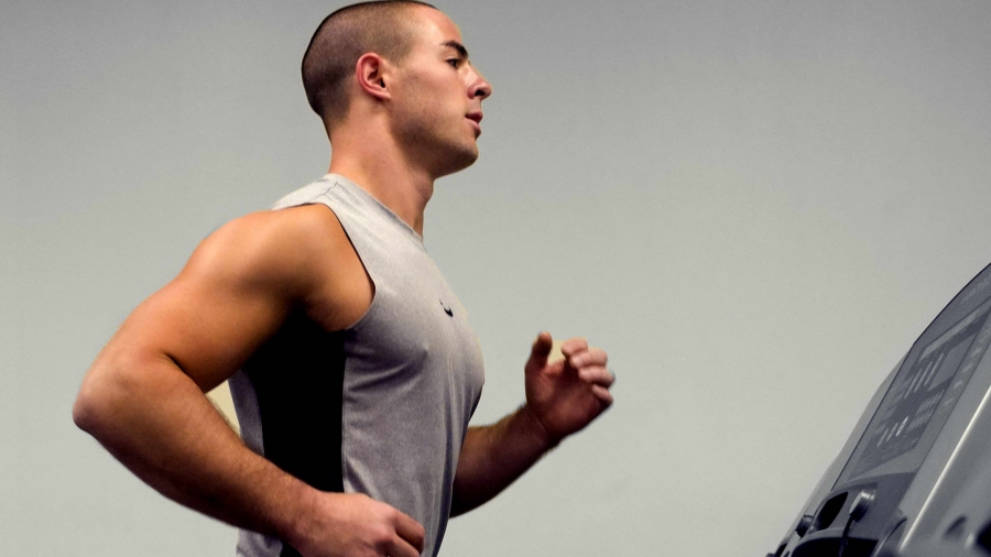 Man running on a treadmill.