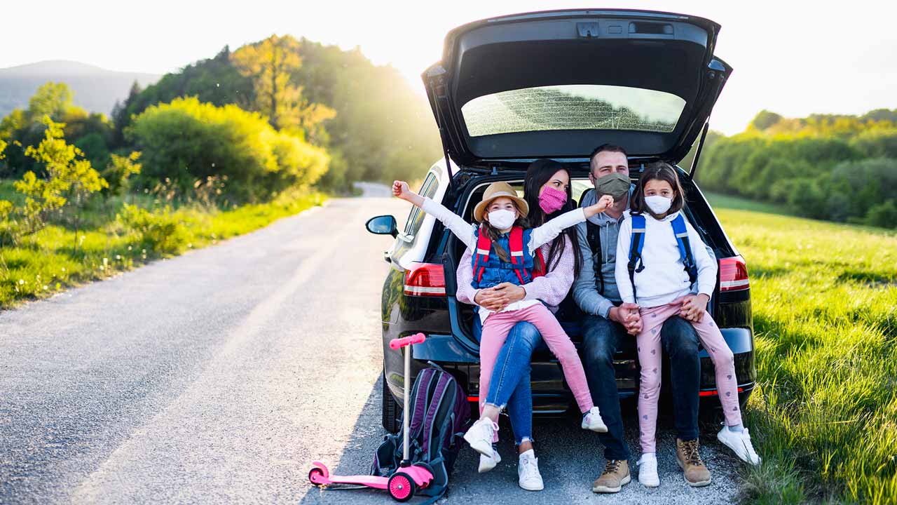 Family traveling with masks on