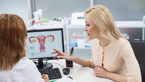 Patient speaking to physician about hysterectomy options.