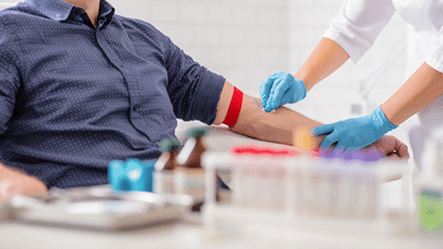 Gentleman getting his blood drawn.