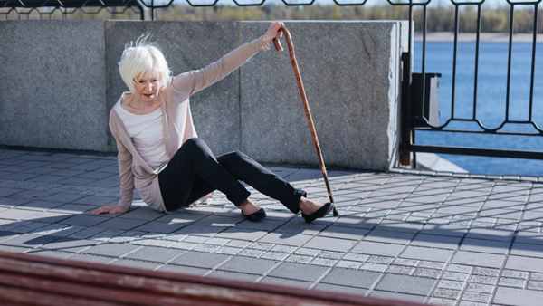 Older woman fell on sidewalk.