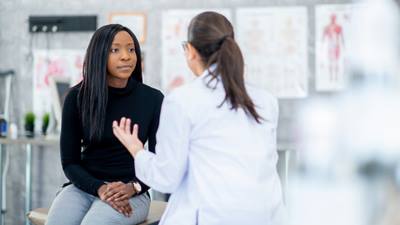 Woman speaks with doctor