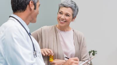 Woman with pill bottle