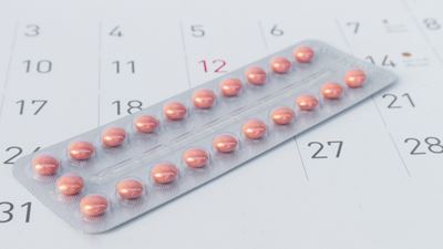 Birth control pills on calendar