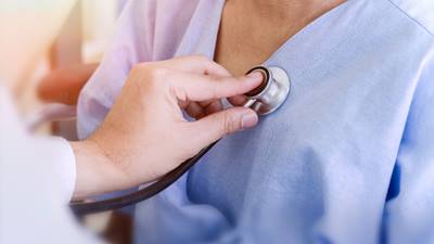 Doctor listening to a patients heart