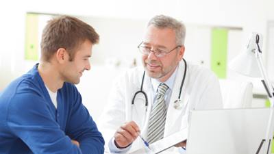 Male doctor talking to male patient