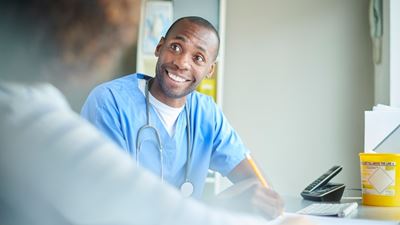 Male nurse assessing patient