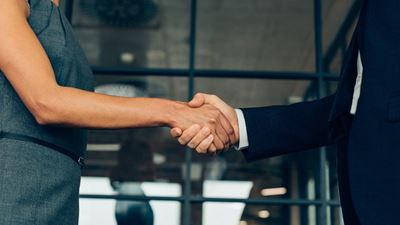 Man and woman shaking hands