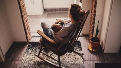 Mother and baby in rocking chair
