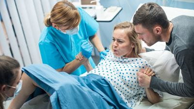 Woman giving birth naturally