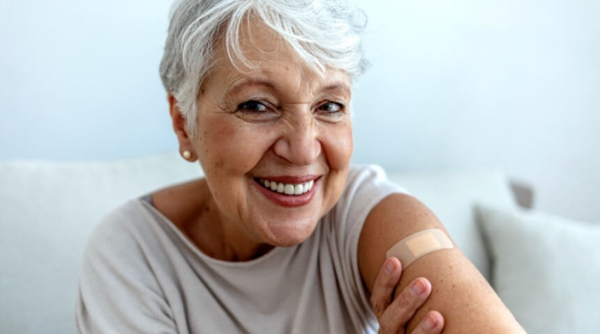 Older lady showing her bandage