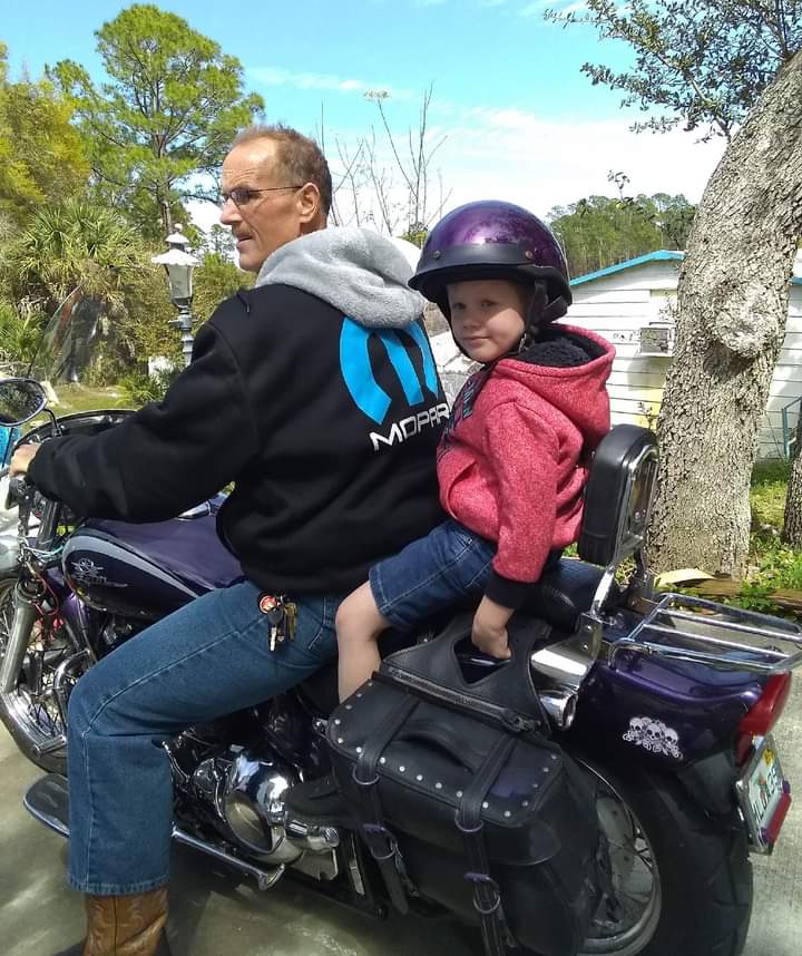 Man and Child on motorcycle