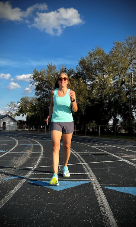 Lady walking on a track