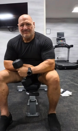 Man flexing in gym
