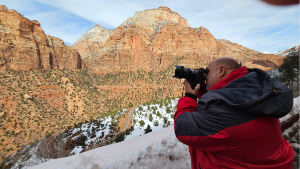 Man taking picture of mountain