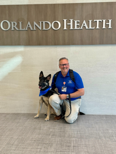 Man smiling next to dog