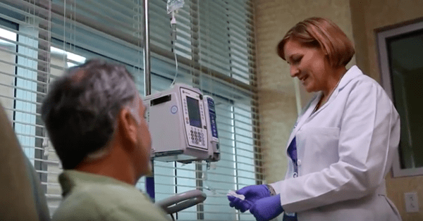 Physician providing treatment to a male patient.