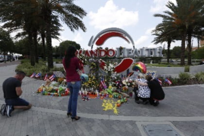 People gathering at the onePulse Memorial