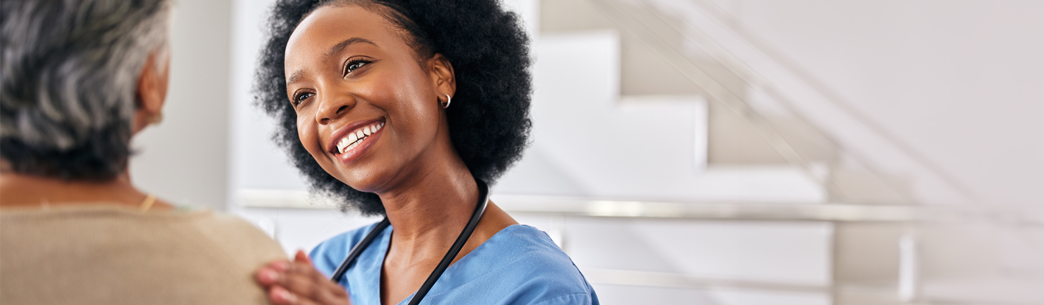 Nurse touching patient's shoulder