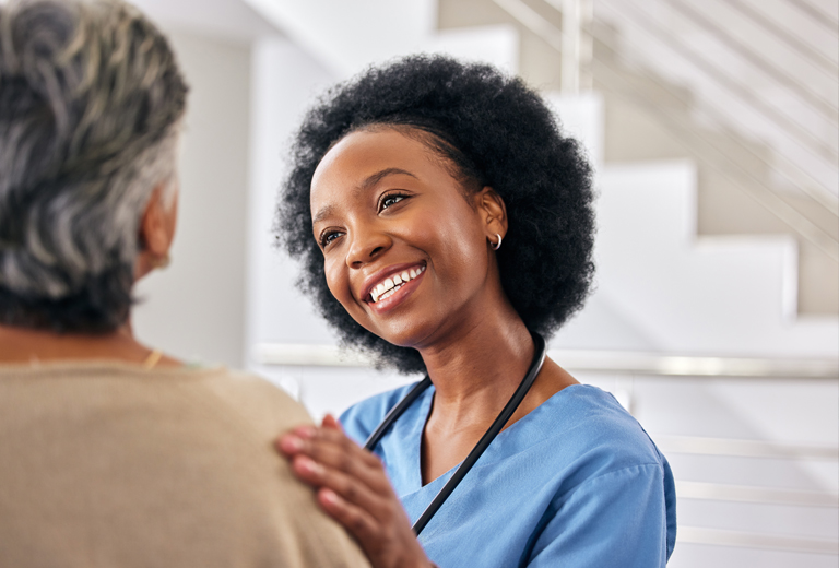 Nurse touching patient's shoulder