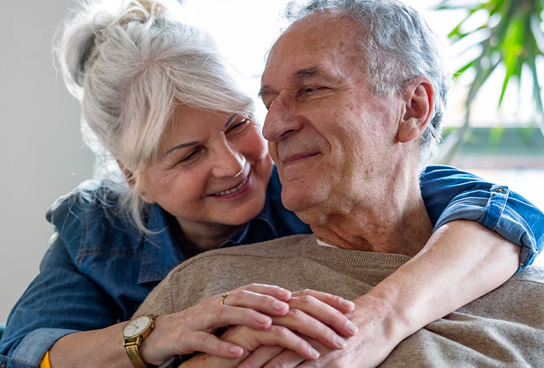 woman hugging man from behind