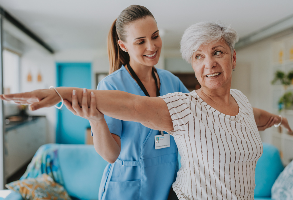 nurse helping woman stretch arms