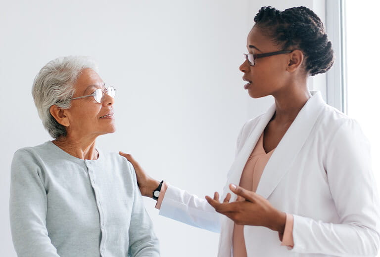 doctor speaking with patient
