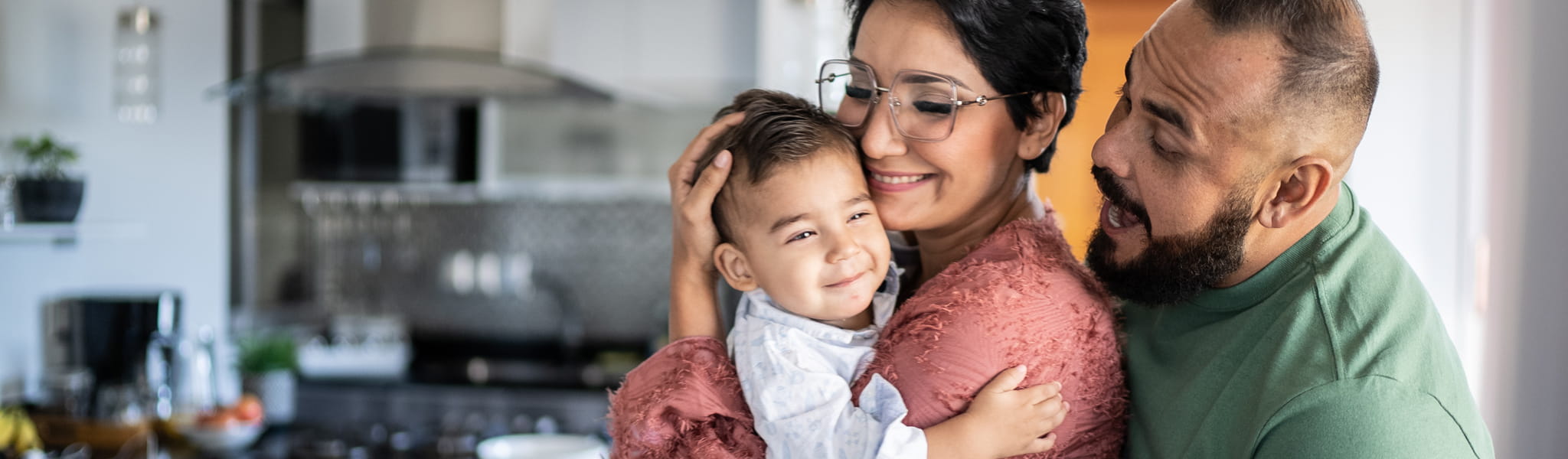 Wife and Husband holding baby