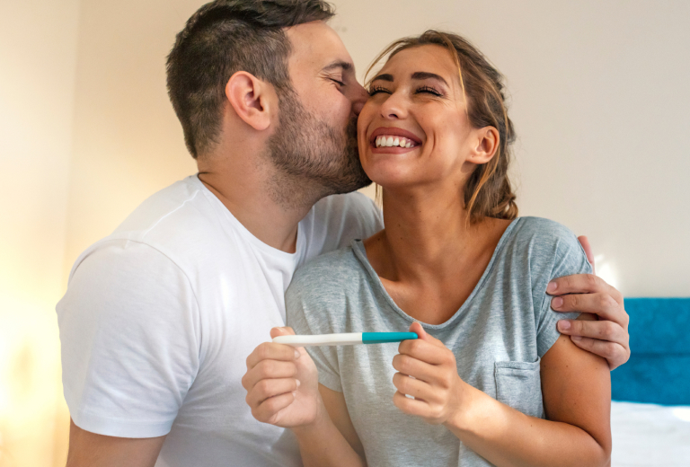 Husband and wife with pregnancy test