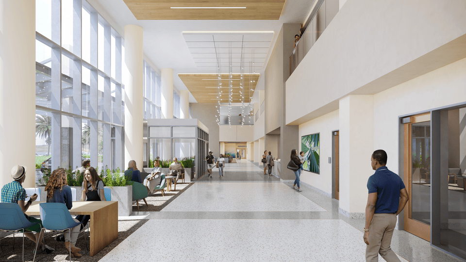 People walking and sitting around hospital lobby