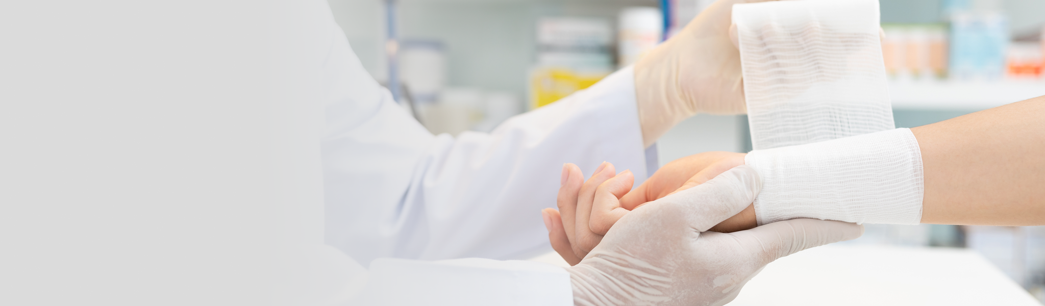 Doctor wrapping patients wrist