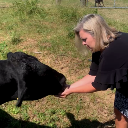 Tonya Oxford feeding an animal