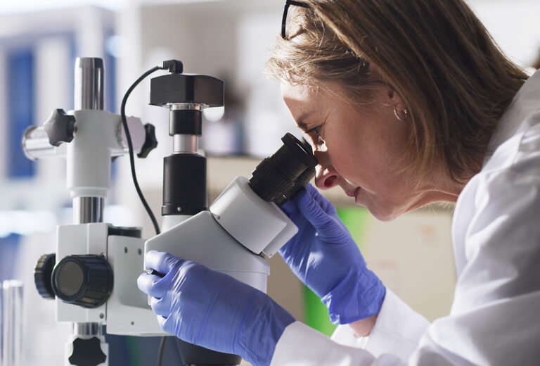 female doctor looking through medical equipment