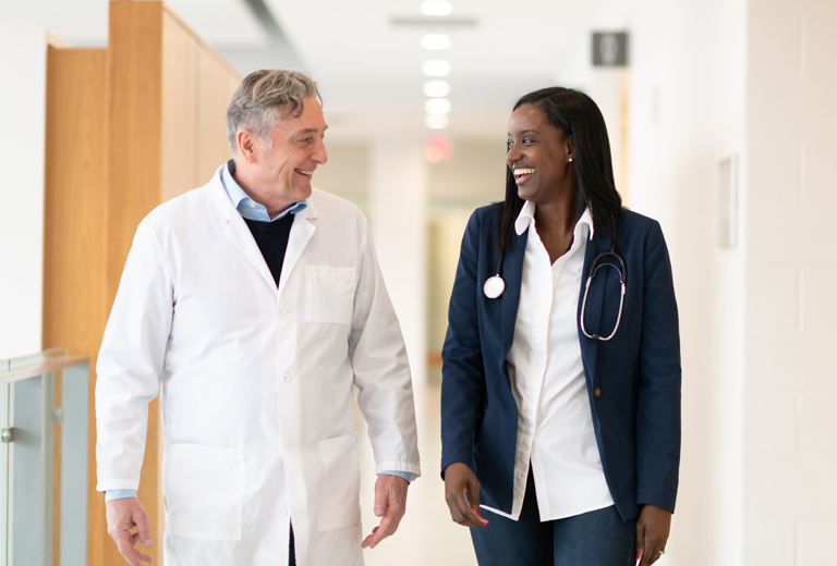 doctors walking in hallway of hospital