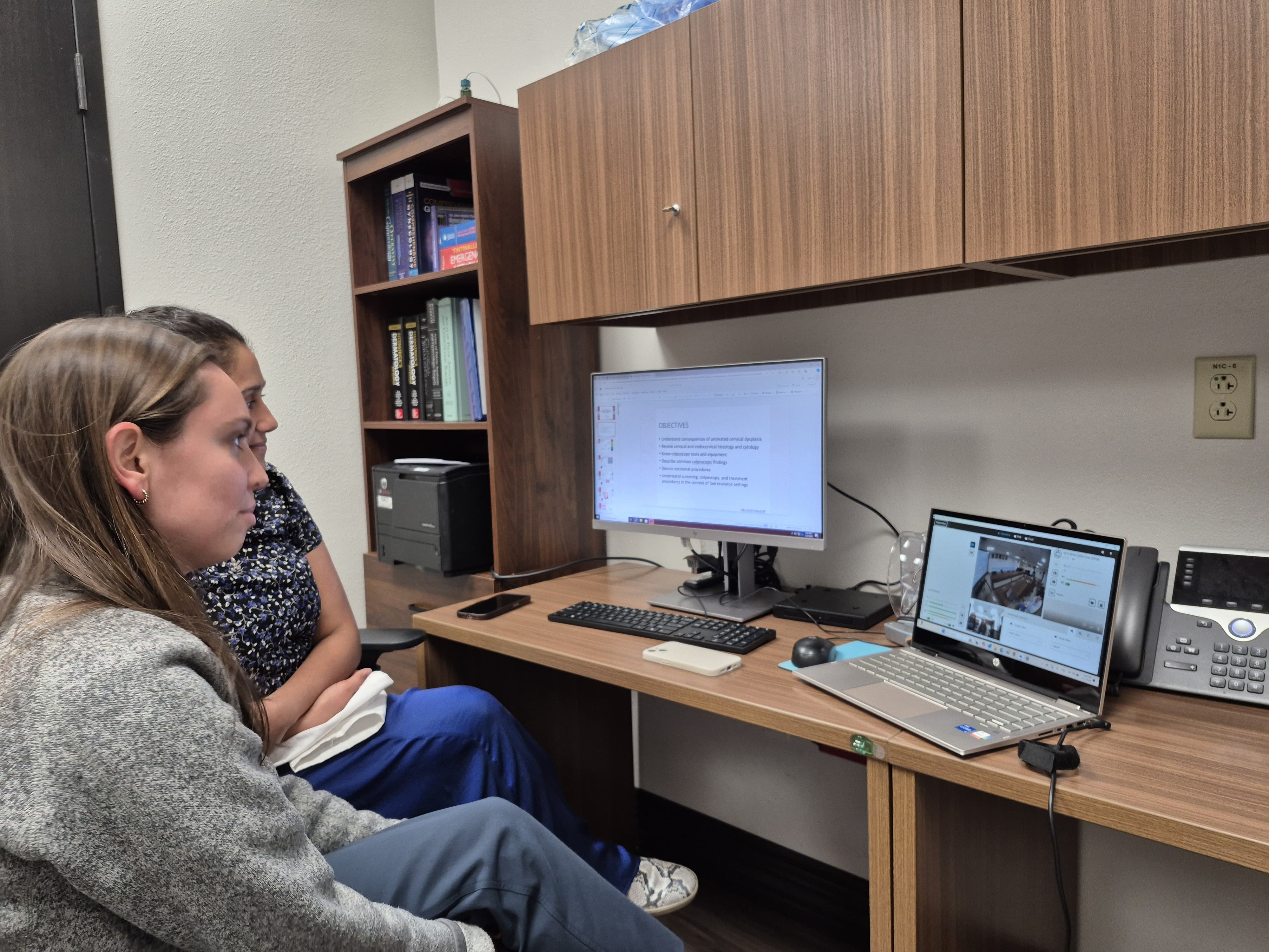 Person looking at computer screens