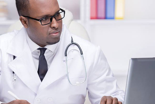 Physician on laptop