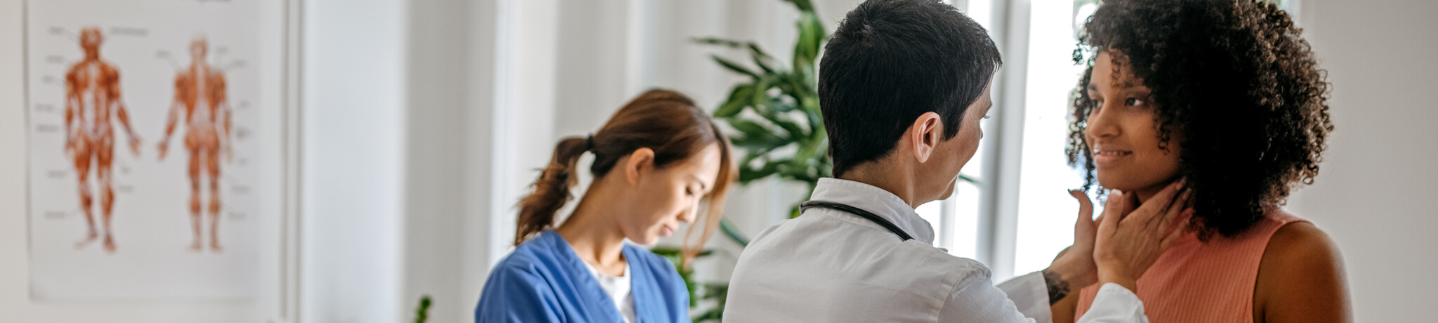 doctor giving patient a physical