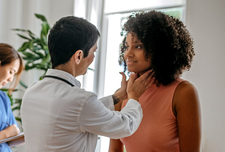 doctor giving patient a physical