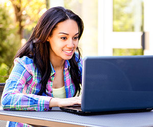 Girl looking at her laptop