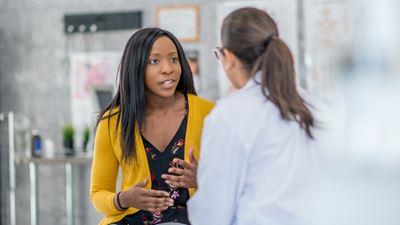 Female patient talking with female doctor