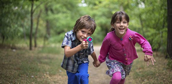 Kids running in the woods