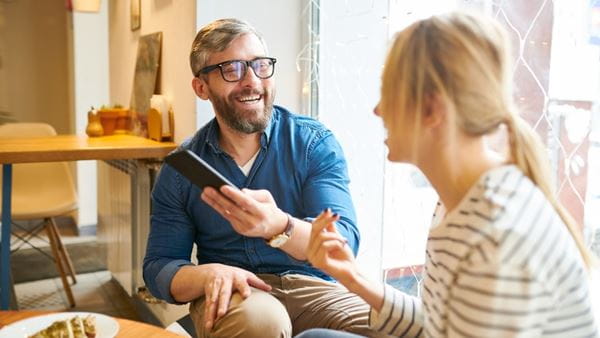 Man and woman laugh