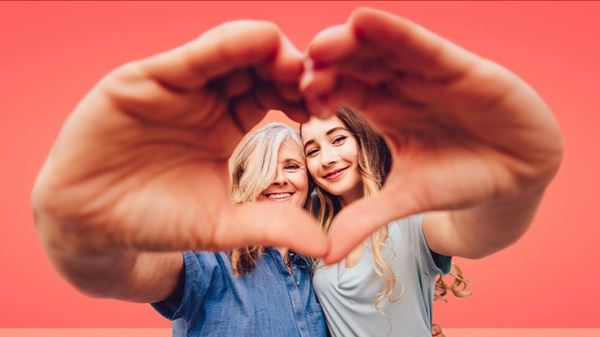 mother and daughter hand heart