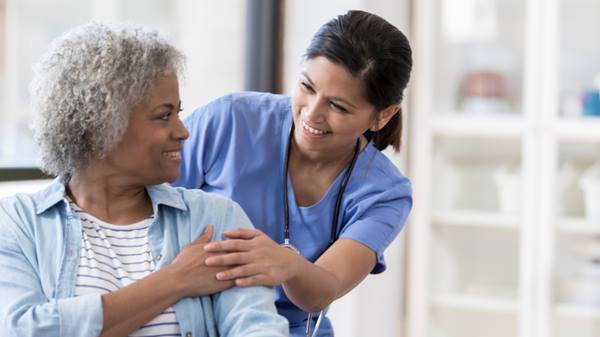 Nurse smiling at patient