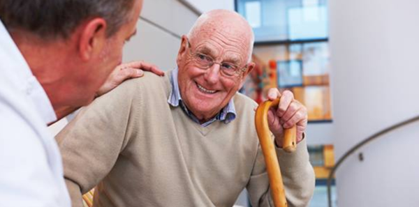 Older gentleman speaking to a physician.