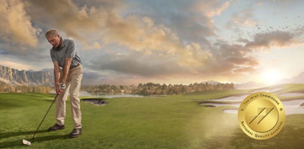 Older gentleman playing golf on course.