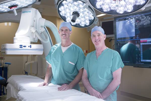 Dr. Sand and Dr. Bott in operating room.